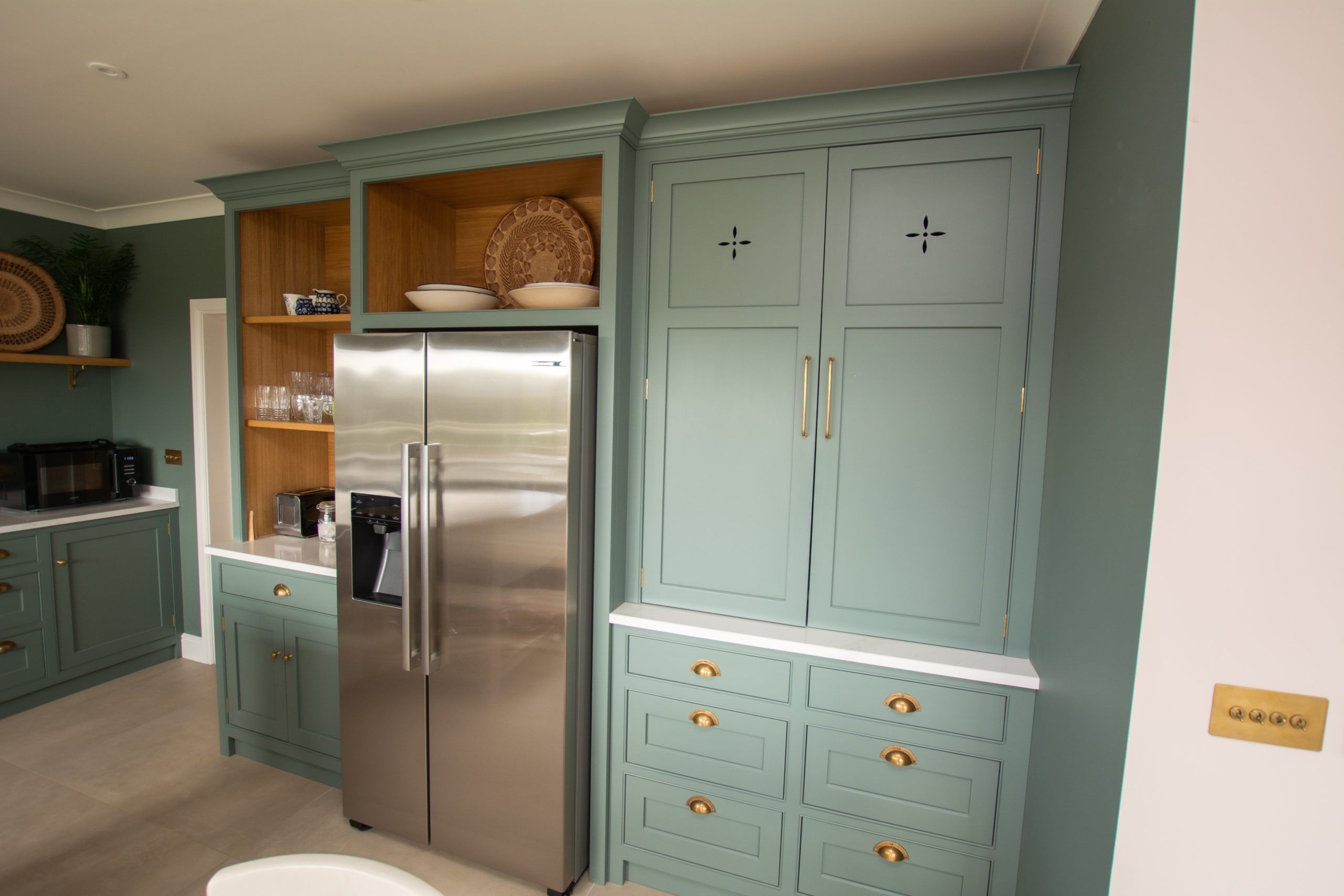 Bespoke fitted kitchen in Abersoch with fret work panel